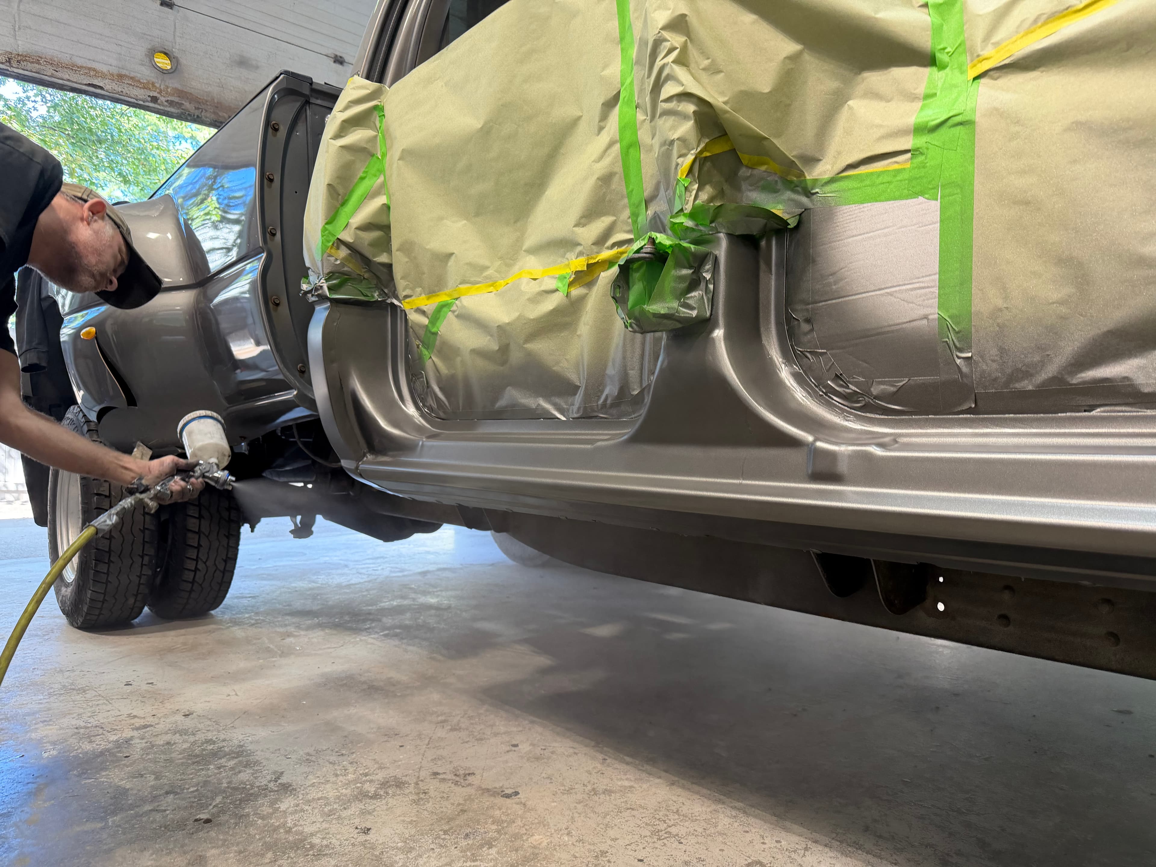 Vehicle repair work at an auto body collision center